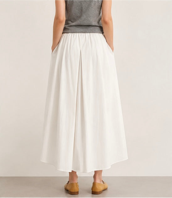Back view of a model wearing the creamy white Joyjocey High-Waist Pleated A-Line Skirt.