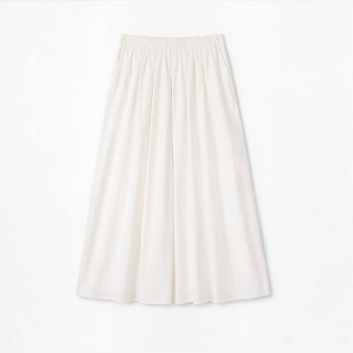 Joyjocey High-Waist Pleated A-Line Skirt in creamy white with an elastic waistband and flowy maxi hem, product front view.