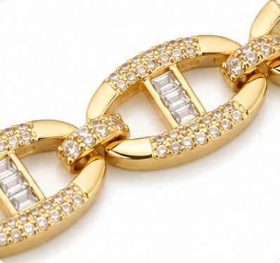 Close-up of the pave crystals, baguette-cut stones and polished oval links on the Joyjocey Gold-Plated Crystal Link Bracelet.