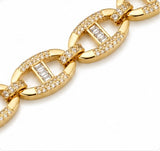 Detailed view of the connected gold-plated oval links and crystal accents on the Joyjocey bracelet.