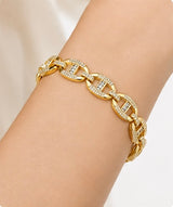 Joyjocey Gold-Plated Crystal Link Bracelet worn on the wrist, showing its polished oval links and crystal accents.