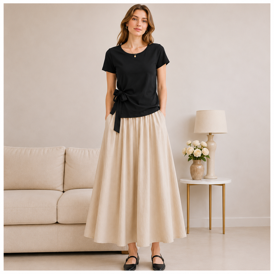 Model wearing the black Joyjocey Side-Tie Cotton Top with a cream maxi skirt, front view.